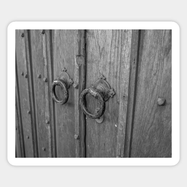 Traditional door knockers on wooden door Sticker by yackers1